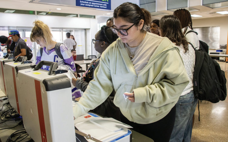 SE student Vanessa Cruz votes on her favorite superheroes at a mock voting
event. The event was held to prepare new voters for the voting process.